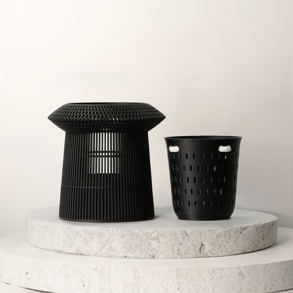 Black VerdiPot Revolve self-watering planter beside its removable air-pruning inner pot.